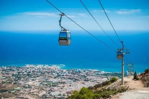 A cable-car gondola climbing Monte Calamorro above the Benalmádena coast