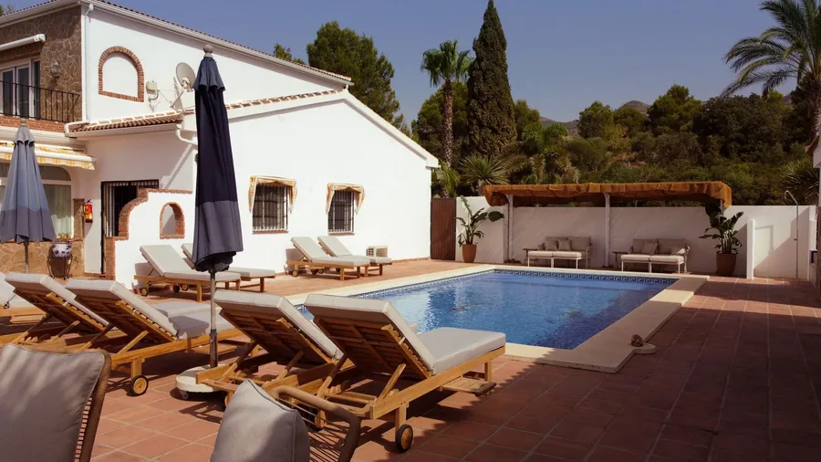 Sun loungers beside the pool